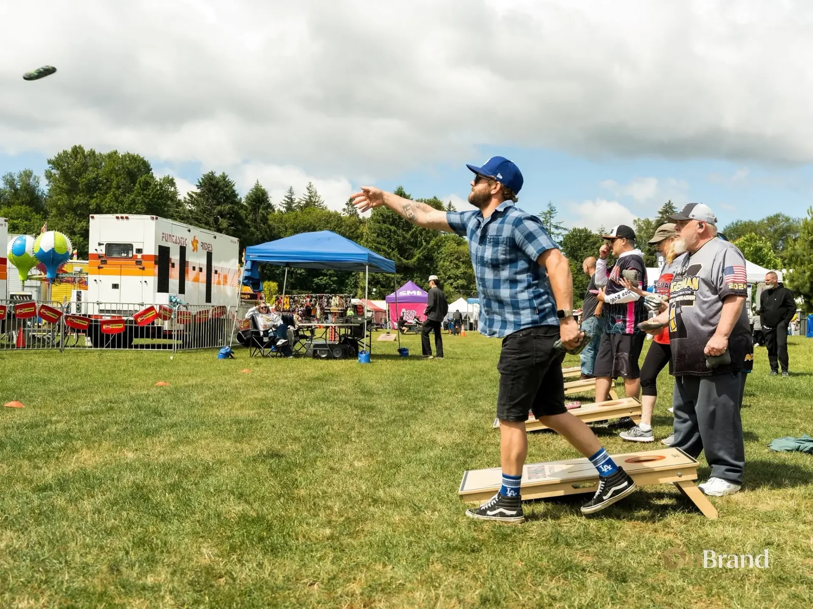 Cornhole tournament players at KeizerFEST
