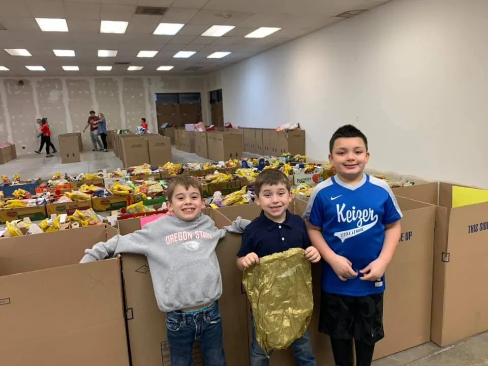 Volunteers assembling holiday food and gift boxes for Keizer families.