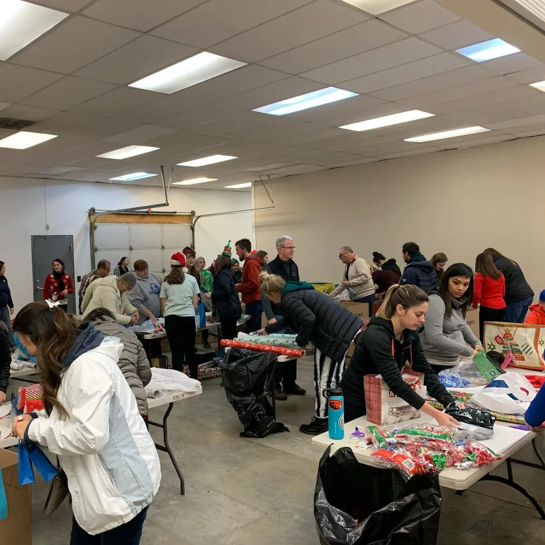 Volunteers assembling holiday food and gift boxes for Keizer families.