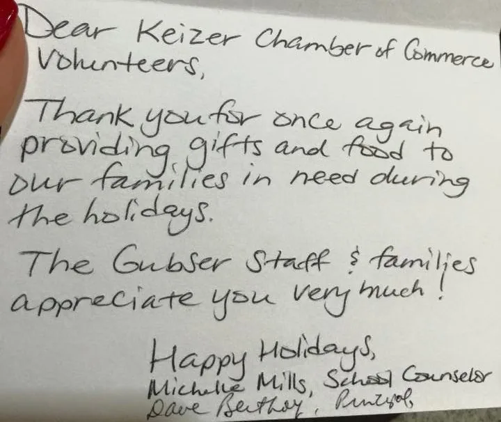 Volunteers assembling holiday food and gift boxes for Keizer families.
