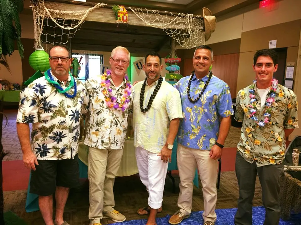 M.A.K. crew in Hawaiian-themed dress helping at PERCEY