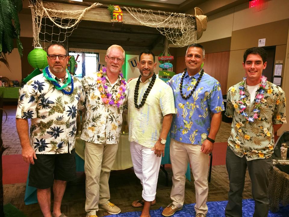Guys dressed for Hawaiian themed party