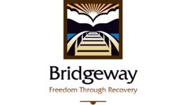 Bridgeway Logo - Freedom Through Recovery - square picture with brown border - of a bridge going over a blue body of water toward Mountains with white clouds and a sun rising above the clouds.