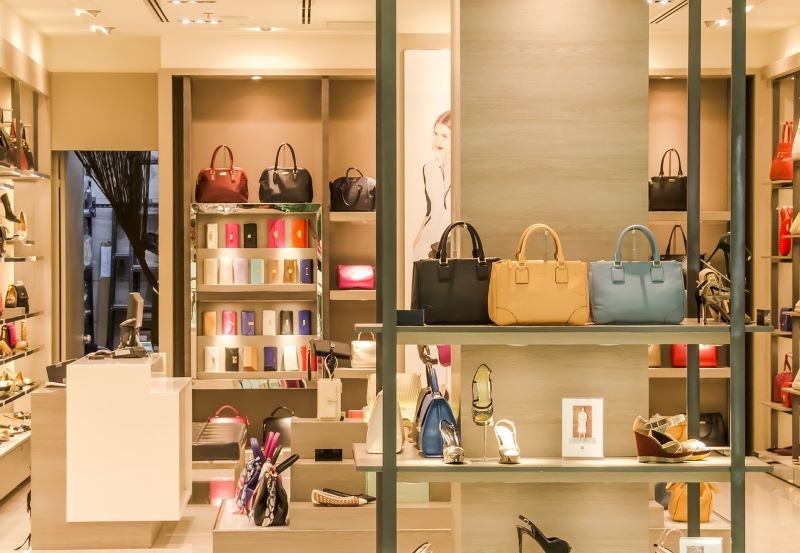 Handbag / Purse Store - wit lots of shelves - multi colors of purses and wood like shelves