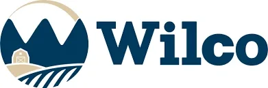 Wilco Logo - navy blue - circle favicon with three triangle mountains and fields in foreground.